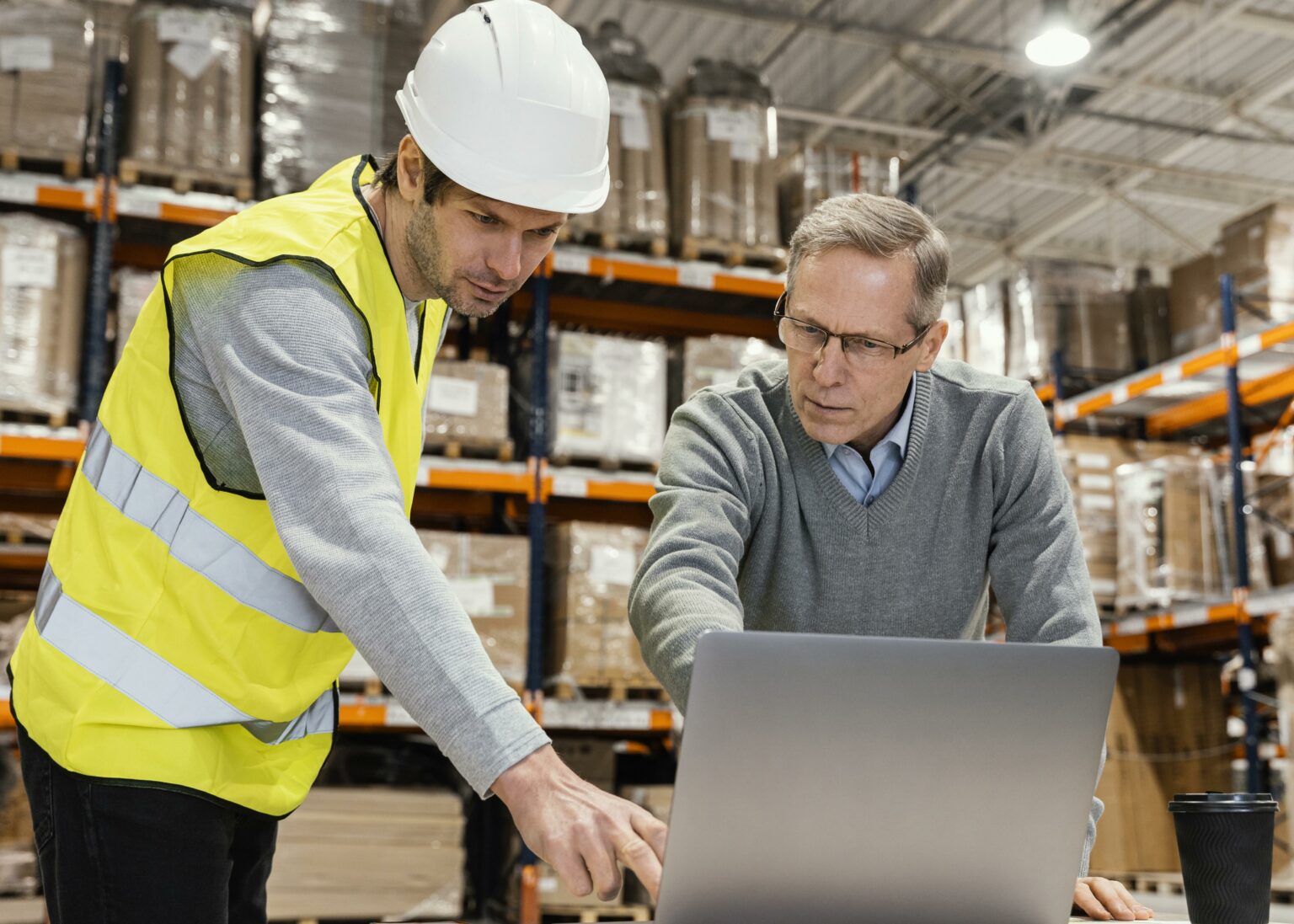 men-warehouse-working-laptop